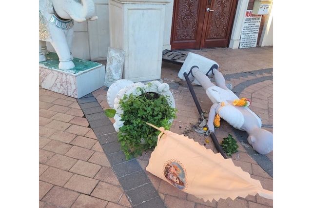 Pictures provided by Assemblywoman Jenifer Rajkumar's office show the statue toppled over outside the temple.